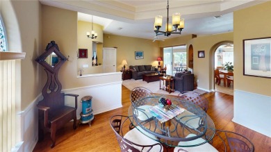 Experience refined Florida living in this meticulously on The Grand Club - Pine Lakes Course in Florida - for sale on GolfHomes.com, golf home, golf lot