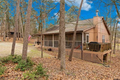 Enjoy this darling 2 bedroom & 2 bath home on two lots with two on Holly Lake Ranch Golf Club in Texas - for sale on GolfHomes.com, golf home, golf lot
