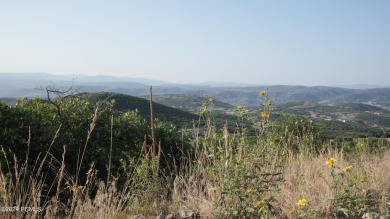 Stunning downhill building lot with magnificent 180 degree views on Talisker Club At Tuhaye in Utah - for sale on GolfHomes.com, golf home, golf lot