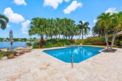 This exceptional lakeside estate blends sophistication, comfort on Bocaire Country Club in Florida - for sale on GolfHomes.com, golf home, golf lot