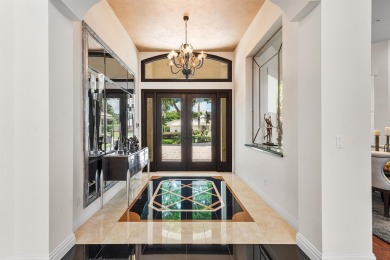 This exceptional lakeside estate blends sophistication, comfort on Bocaire Country Club in Florida - for sale on GolfHomes.com, golf home, golf lot