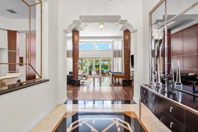 This exceptional lakeside estate blends sophistication, comfort on Bocaire Country Club in Florida - for sale on GolfHomes.com, golf home, golf lot