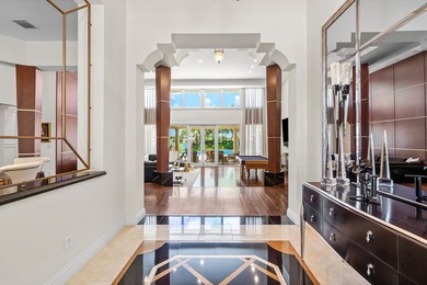 This exceptional lakeside estate blends sophistication, comfort on Bocaire Country Club in Florida - for sale on GolfHomes.com, golf home, golf lot