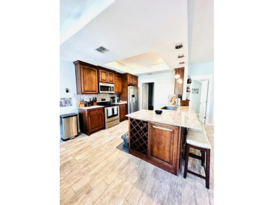 Income-Producing Waterfront Luxury! This channel-front townhome on South Padre Island Golf Club in Texas - for sale on GolfHomes.com, golf home, golf lot