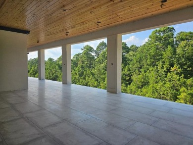 EXQUISITE MODERN LUXURY! Surrounding this gated spread is a LUXE on Chenal Country Club - Bear Den Mountain in Arkansas - for sale on GolfHomes.com, golf home, golf lot