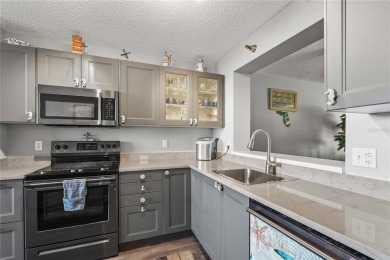 This beautifully updated first-floor condo in The Woods at on Pinebrook/Ironwood Golf Course in Florida - for sale on GolfHomes.com, golf home, golf lot