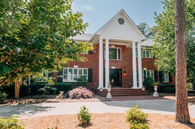 This exquisite brick home is tucked away on a cul-de-sac within on Pinewild Country Club of Pinehurst in North Carolina - for sale on GolfHomes.com, golf home, golf lot