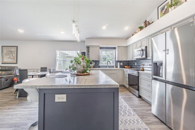 STUNNING REMODELED HOME, with over $40,000 in recent upgrades on Tampa Bay Golf and Country Club in Florida - for sale on GolfHomes.com, golf home, golf lot