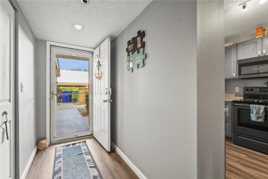 This beautifully updated first-floor condo in The Woods at on Pinebrook/Ironwood Golf Course in Florida - for sale on GolfHomes.com, golf home, golf lot