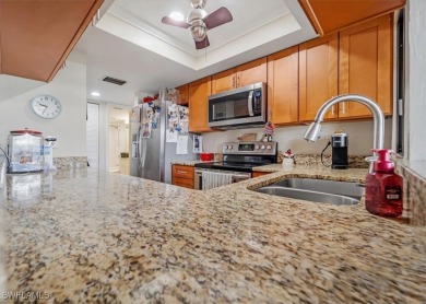 Discover this stunning 2-bedroom, 2-bath 1st-floor corner end on Hideaway Country Club in Florida - for sale on GolfHomes.com, golf home, golf lot