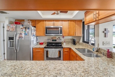 Discover this stunning 2-bedroom, 2-bath 1st-floor corner end on Hideaway Country Club in Florida - for sale on GolfHomes.com, golf home, golf lot