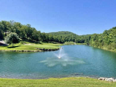 This pristine lodge located at the Cabins on Roark Creek in on Ledgestone Country Club and Golf Course in Missouri - for sale on GolfHomes.com, golf home, golf lot