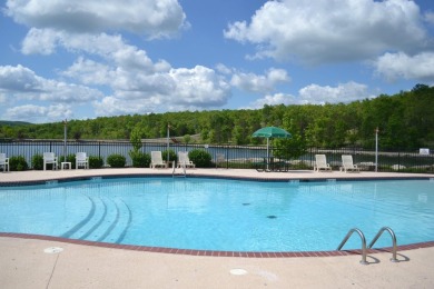 This pristine lodge located at the Cabins on Roark Creek in on Ledgestone Country Club and Golf Course in Missouri - for sale on GolfHomes.com, golf home, golf lot