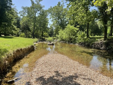 This pristine lodge located at the Cabins on Roark Creek in on Ledgestone Country Club and Golf Course in Missouri - for sale on GolfHomes.com, golf home, golf lot