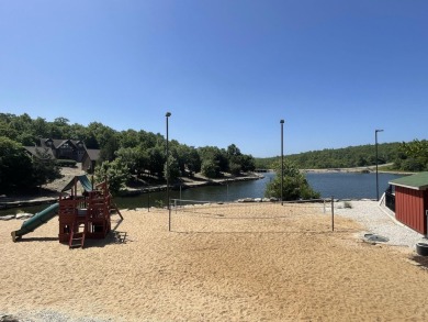 This pristine lodge located at the Cabins on Roark Creek in on Ledgestone Country Club and Golf Course in Missouri - for sale on GolfHomes.com, golf home, golf lot