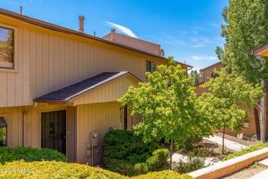 Overlooking the 17th hole, this beautifully updated townhome on Aspen Valley Golf Club in Arizona - for sale on GolfHomes.com, golf home, golf lot
