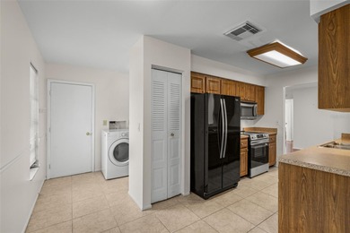 Welcome home to this updated, move-in ready Palm Harbor retreat on Highland Lakes Executive Golf Course in Florida - for sale on GolfHomes.com, golf home, golf lot