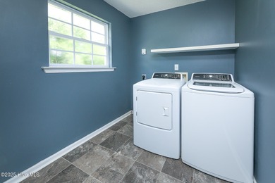 Welcome to this beautiful two- story 4 bedroom 2.5 bathroom home on Eagle Creek Golf Club and Grill in North Carolina - for sale on GolfHomes.com, golf home, golf lot