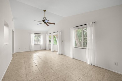 Welcome home to this updated, move-in ready Palm Harbor retreat on Highland Lakes Executive Golf Course in Florida - for sale on GolfHomes.com, golf home, golf lot