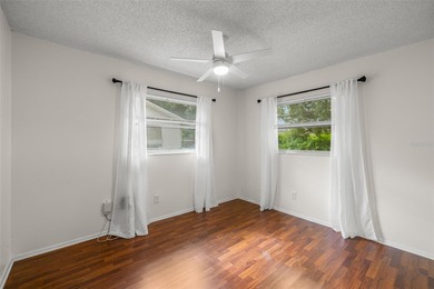 Welcome home to this updated, move-in ready Palm Harbor retreat on Highland Lakes Executive Golf Course in Florida - for sale on GolfHomes.com, golf home, golf lot