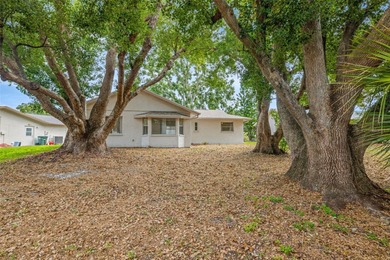 Welcome home to this updated, move-in ready Palm Harbor retreat on Highland Lakes Executive Golf Course in Florida - for sale on GolfHomes.com, golf home, golf lot