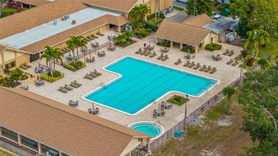 Welcome home to this updated, move-in ready Palm Harbor retreat on Highland Lakes Executive Golf Course in Florida - for sale on GolfHomes.com, golf home, golf lot