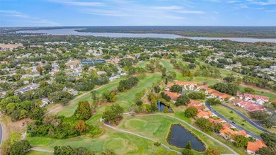 Welcome home to this updated, move-in ready Palm Harbor retreat on Highland Lakes Executive Golf Course in Florida - for sale on GolfHomes.com, golf home, golf lot