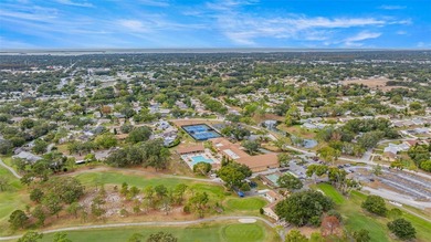 Welcome home to this updated, move-in ready Palm Harbor retreat on Highland Lakes Executive Golf Course in Florida - for sale on GolfHomes.com, golf home, golf lot