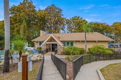 Welcome home to this updated, move-in ready Palm Harbor retreat on Highland Lakes Executive Golf Course in Florida - for sale on GolfHomes.com, golf home, golf lot