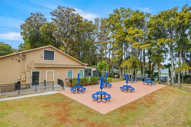 Welcome home to this updated, move-in ready Palm Harbor retreat on Highland Lakes Executive Golf Course in Florida - for sale on GolfHomes.com, golf home, golf lot