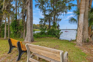 Welcome home to this updated, move-in ready Palm Harbor retreat on Highland Lakes Executive Golf Course in Florida - for sale on GolfHomes.com, golf home, golf lot