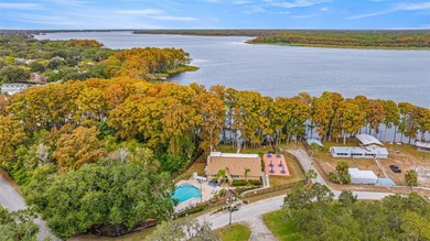 Welcome home to this updated, move-in ready Palm Harbor retreat on Highland Lakes Executive Golf Course in Florida - for sale on GolfHomes.com, golf home, golf lot