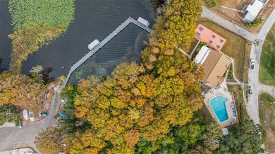 Welcome home to this updated, move-in ready Palm Harbor retreat on Highland Lakes Executive Golf Course in Florida - for sale on GolfHomes.com, golf home, golf lot