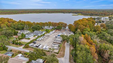 Welcome home to this updated, move-in ready Palm Harbor retreat on Highland Lakes Executive Golf Course in Florida - for sale on GolfHomes.com, golf home, golf lot