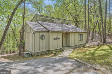 Welcome home to this beautiful contemporary with SEASONAL LAKE on The Highlands Course at Lake Arrowhead in Georgia - for sale on GolfHomes.com, golf home, golf lot