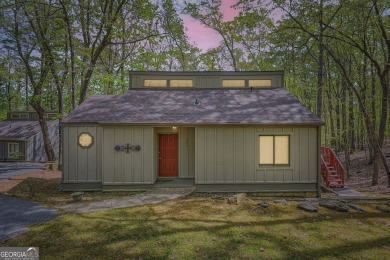 Welcome home to this beautiful contemporary with SEASONAL LAKE on The Highlands Course at Lake Arrowhead in Georgia - for sale on GolfHomes.com, golf home, golf lot