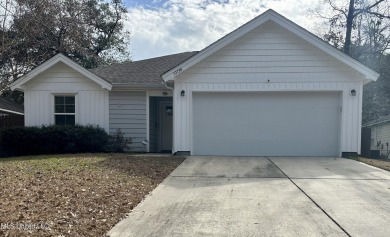 Precious four bedroom two bathroom single family home appointed on Diamondhead Country Club in Mississippi - for sale on GolfHomes.com, golf home, golf lot