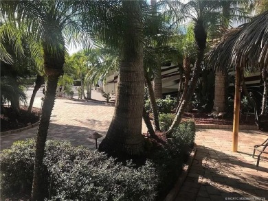 Nestled in the prestigious *millionaires row,* this magnificent on Motorcoach Resort Golf Course in Florida - for sale on GolfHomes.com, golf home, golf lot