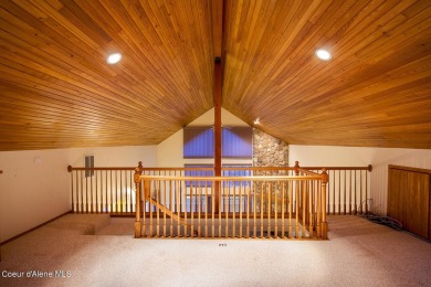 As you step outside, the serene lake surroundings take center on Ponderosa Springs Golf Course in Idaho - for sale on GolfHomes.com, golf home, golf lot