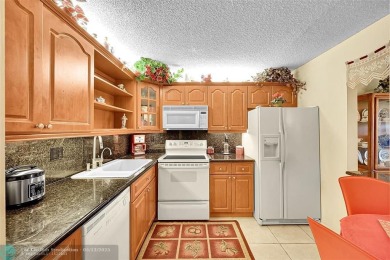 Top floor, corner unit featuring stunning views of the Golf on Boca Dunes Golf and Country Club in Florida - for sale on GolfHomes.com, golf home, golf lot