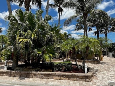 Nestled in the prestigious *millionaires row,* this magnificent on Motorcoach Resort Golf Course in Florida - for sale on GolfHomes.com, golf home, golf lot