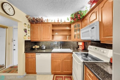 Top floor, corner unit featuring stunning views of the Golf on Boca Dunes Golf and Country Club in Florida - for sale on GolfHomes.com, golf home, golf lot