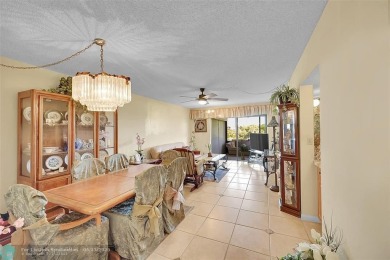 Top floor, corner unit featuring stunning views of the Golf on Boca Dunes Golf and Country Club in Florida - for sale on GolfHomes.com, golf home, golf lot