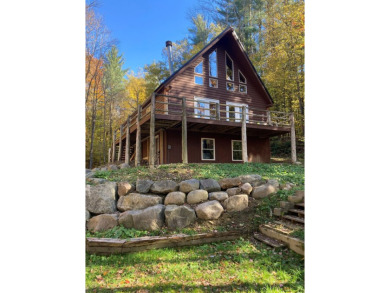 This serene Adirondack Chalet tucked back off the road has been on Malone Golf Club, Inc. in New York - for sale on GolfHomes.com, golf home, golf lot