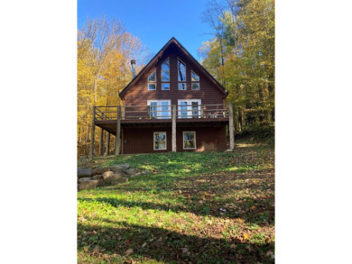 This serene Adirondack Chalet tucked back off the road has been on Malone Golf Club, Inc. in New York - for sale on GolfHomes.com, golf home, golf lot