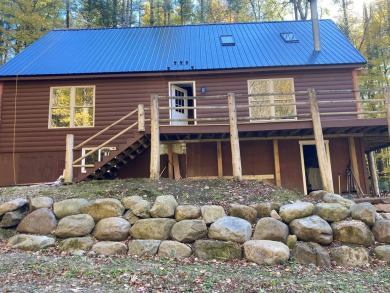 This serene Adirondack Chalet tucked back off the road has been on Malone Golf Club, Inc. in New York - for sale on GolfHomes.com, golf home, golf lot