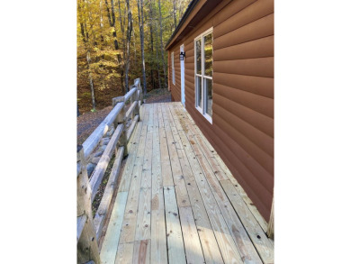 This serene Adirondack Chalet tucked back off the road has been on Malone Golf Club, Inc. in New York - for sale on GolfHomes.com, golf home, golf lot