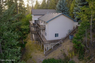 As you step outside, the serene lake surroundings take center on Ponderosa Springs Golf Course in Idaho - for sale on GolfHomes.com, golf home, golf lot