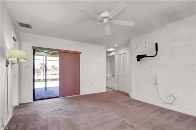 Gulf access pool home with 10,000 lb. boat lift, NO FLOODING! on Saint Andrews South Golf Club in Florida - for sale on GolfHomes.com, golf home, golf lot