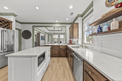 OVERLOOKING THE SIGNATURE 5TH HOLE OF THE JACK NICKLAUS DESIGNED on Great Waters Course At Reynolds Plantation in Georgia - for sale on GolfHomes.com, golf home, golf lot